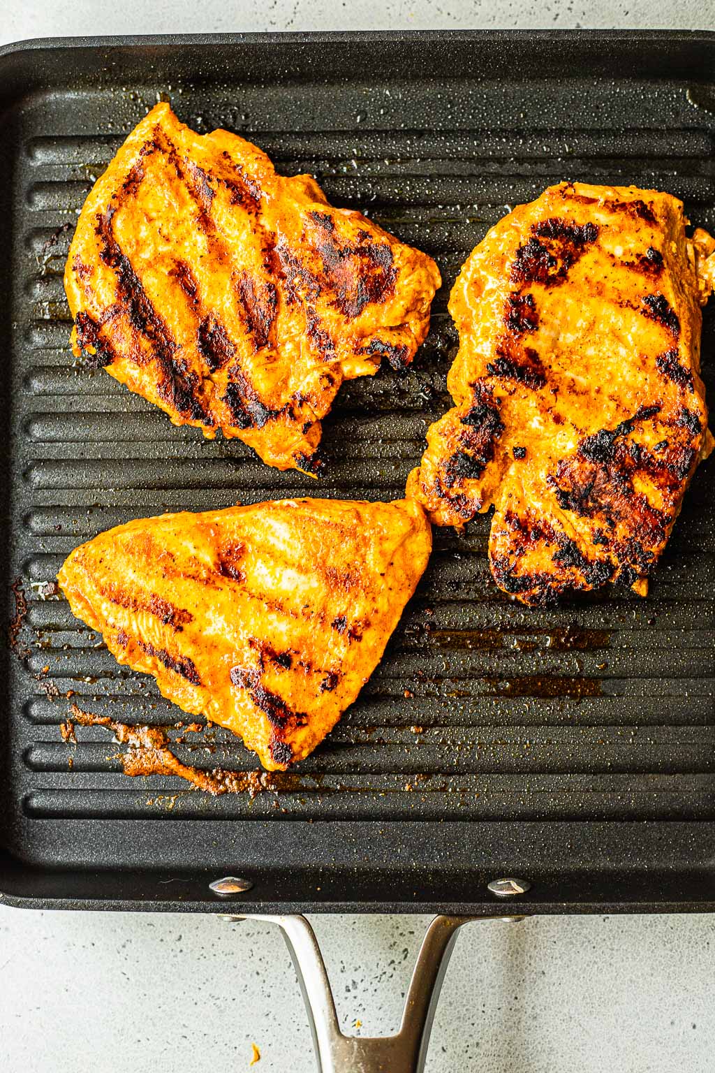 Buffalo chicken on a grill pan 