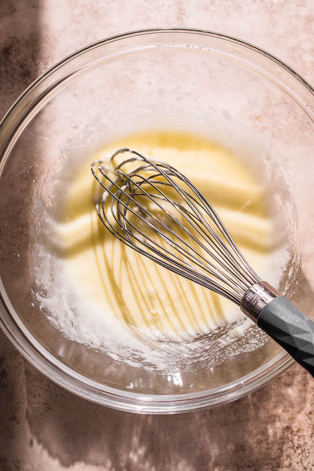 Melted butter, oil, and sugar in a mixing bowl 