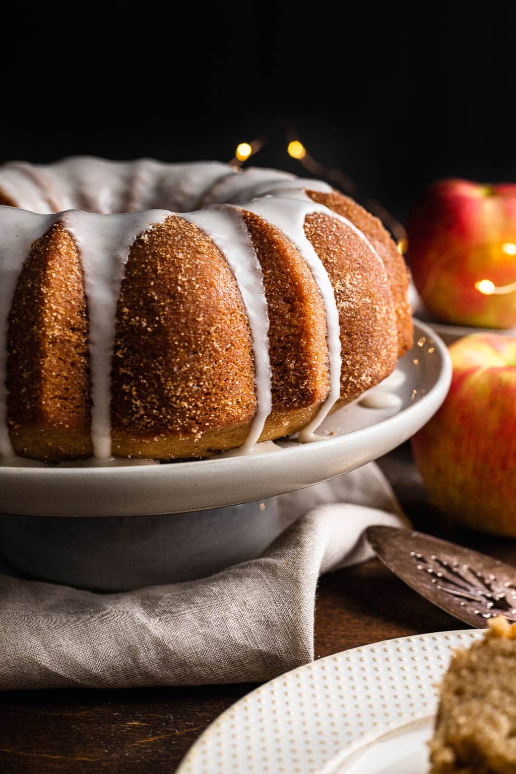 Apple Cider Donut bundt Cake on a cake stand 