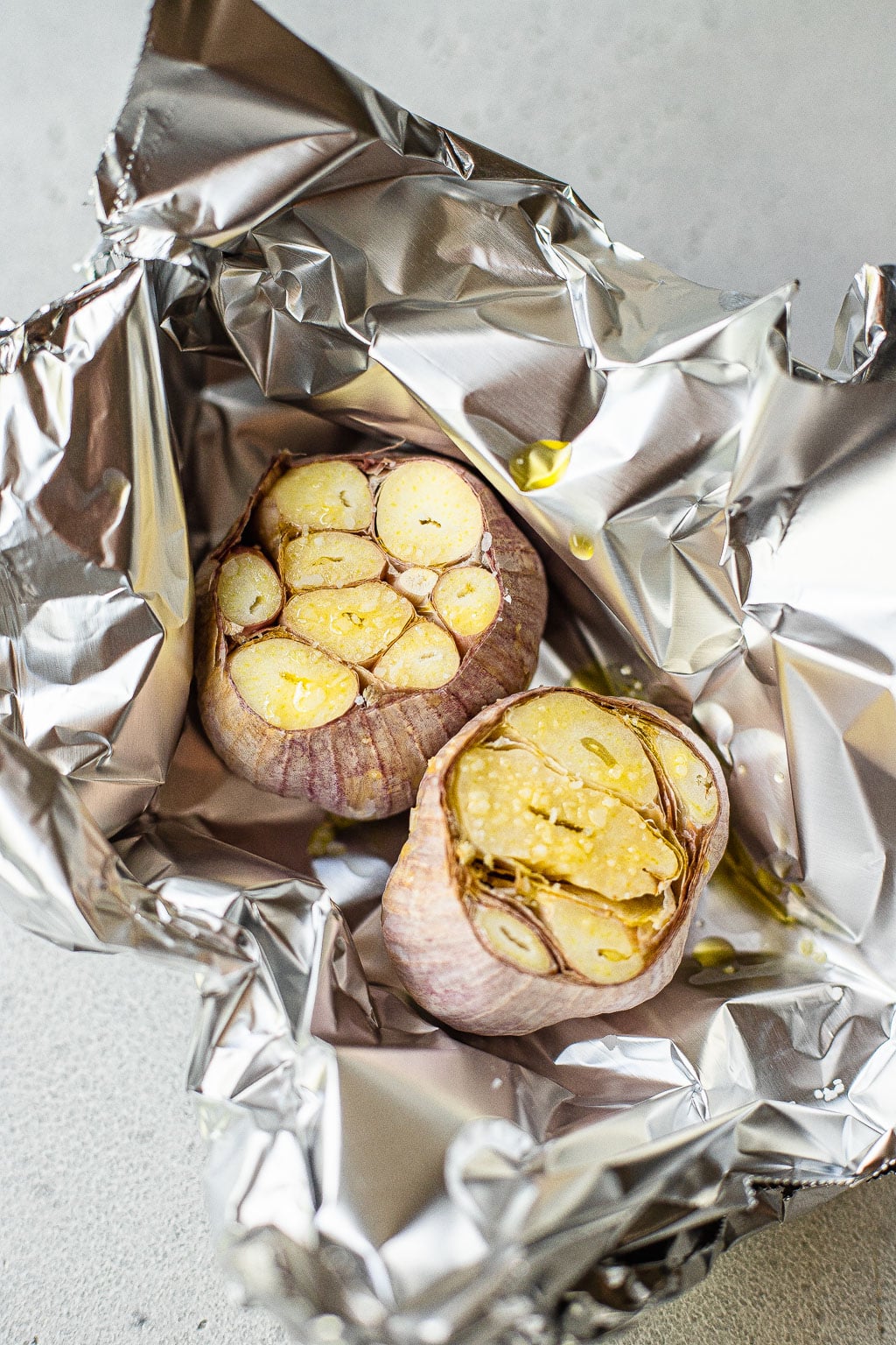 Two heads of garlic before roasting