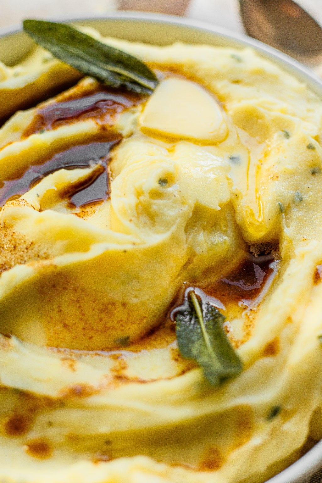 Roasted Garlic Mashed Potatoes topped with butter and sage 