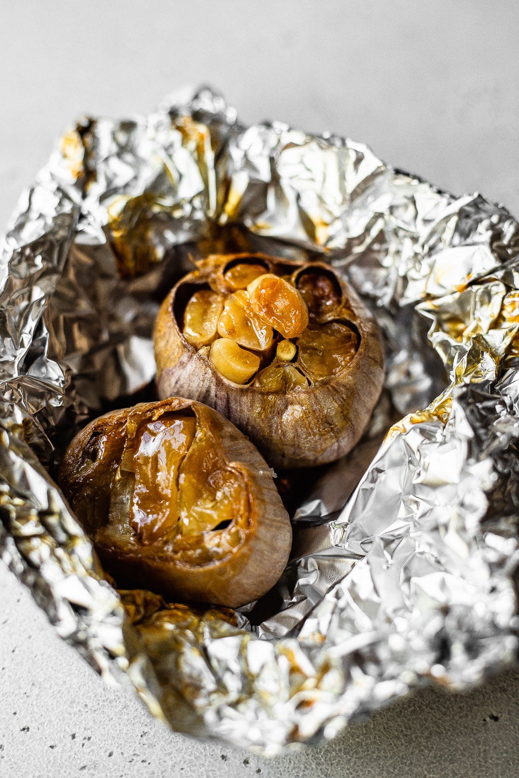 Two heads of garlic after roasting
