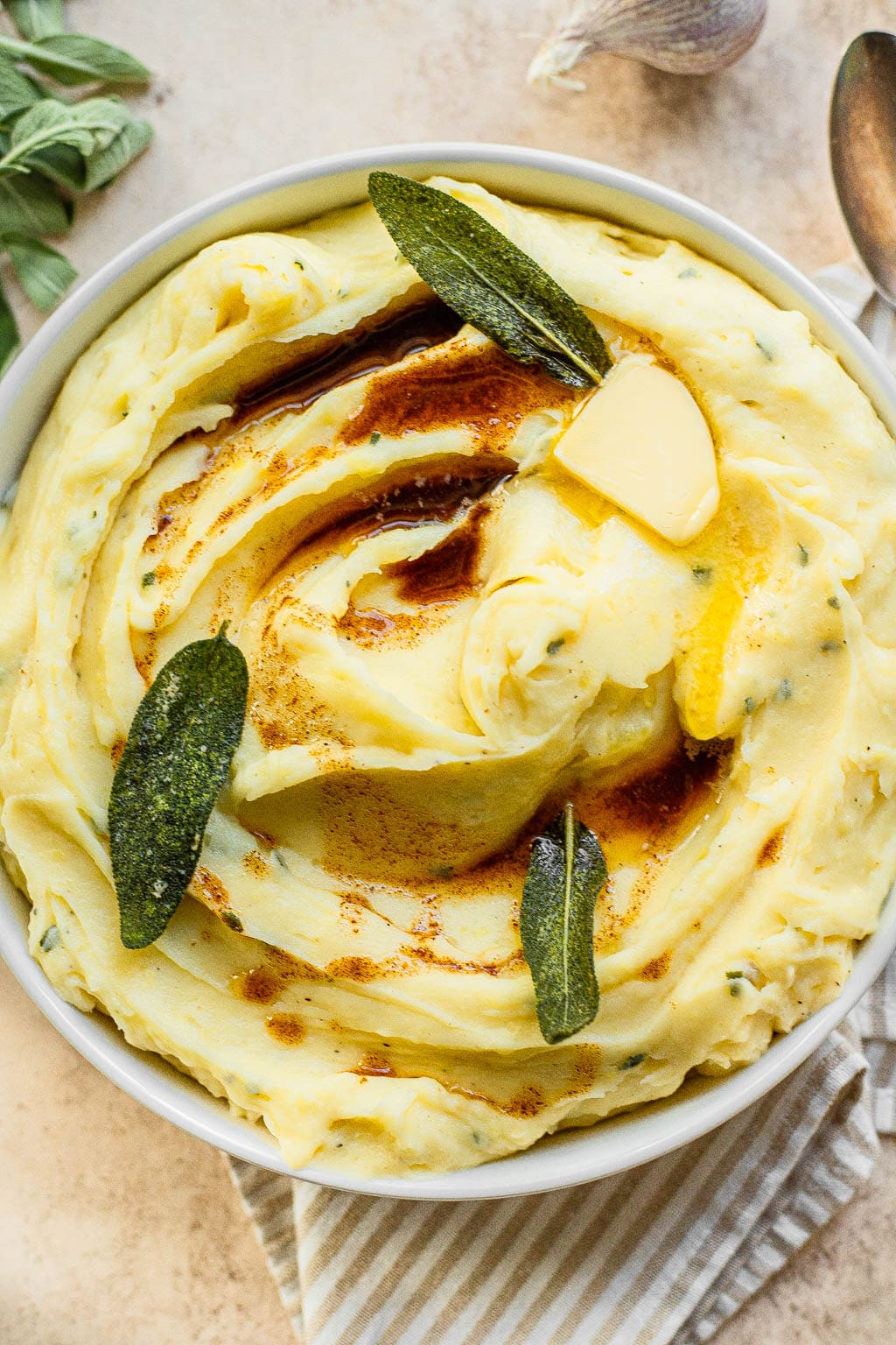 Roasted Garlic Mashed Potatoes topped with butter and sage 