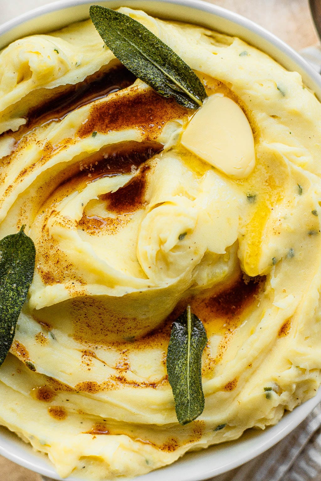 Roasted Garlic Mashed Potatoes topped with butter and sage 