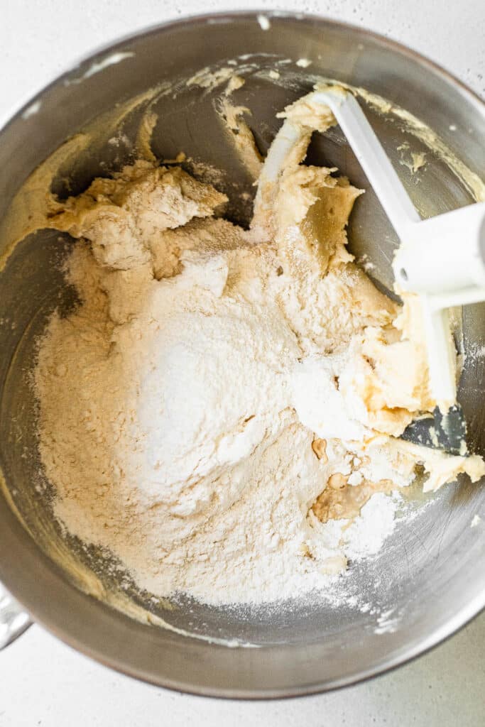 Sugar and butter in a mixing bowl 