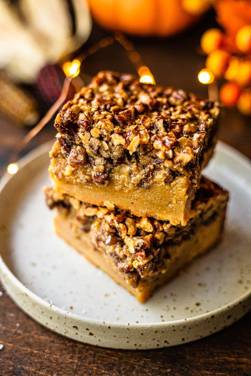 A stack of two pecan pie bars made without corn syrup