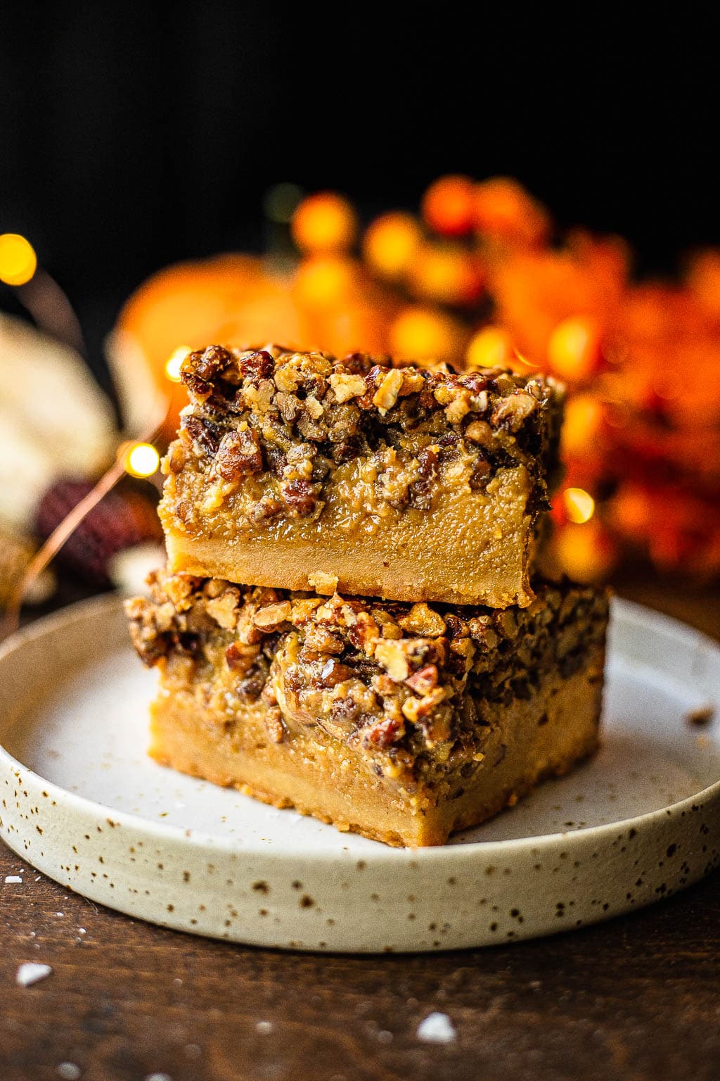 A stack of two pecan pie bars made without corn syrup