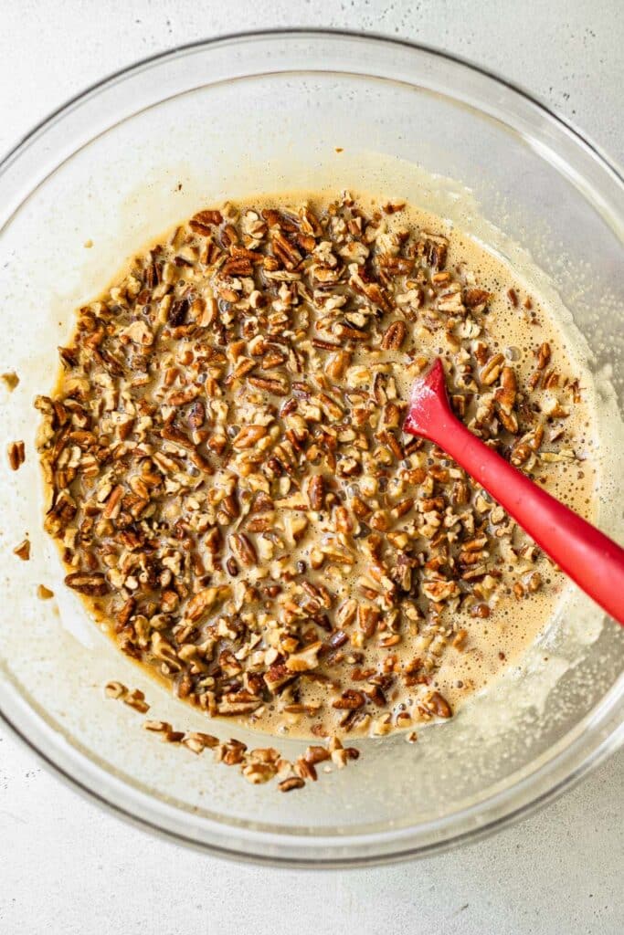 Pecans mixed into pie filling 