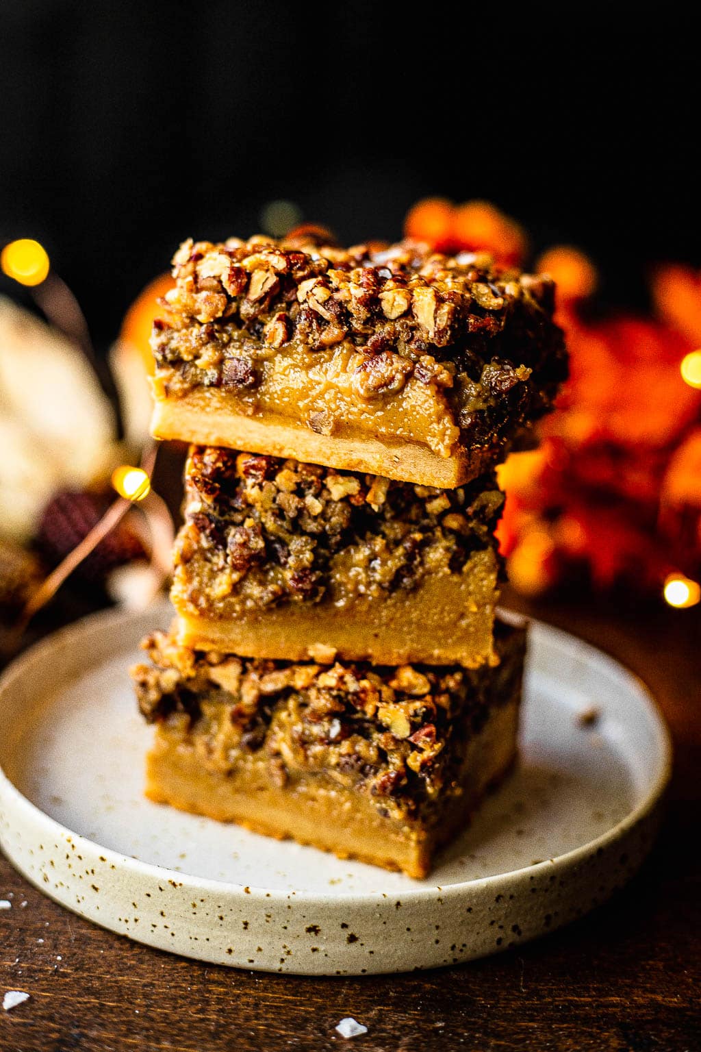 A stack of three pecan pie bars made without corn syrup