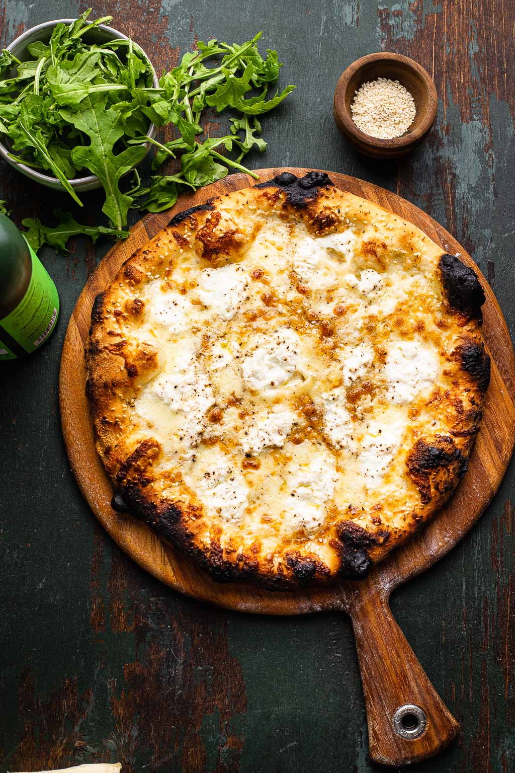 Overhead view of a white pizza. 