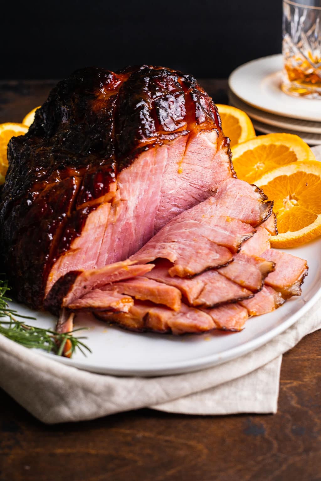 An apricot glazed ham, sliced to show the texture