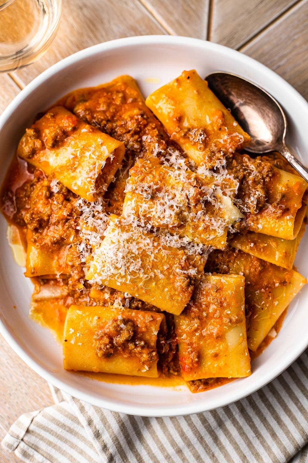 Pasta bolognese topped with grated Parm