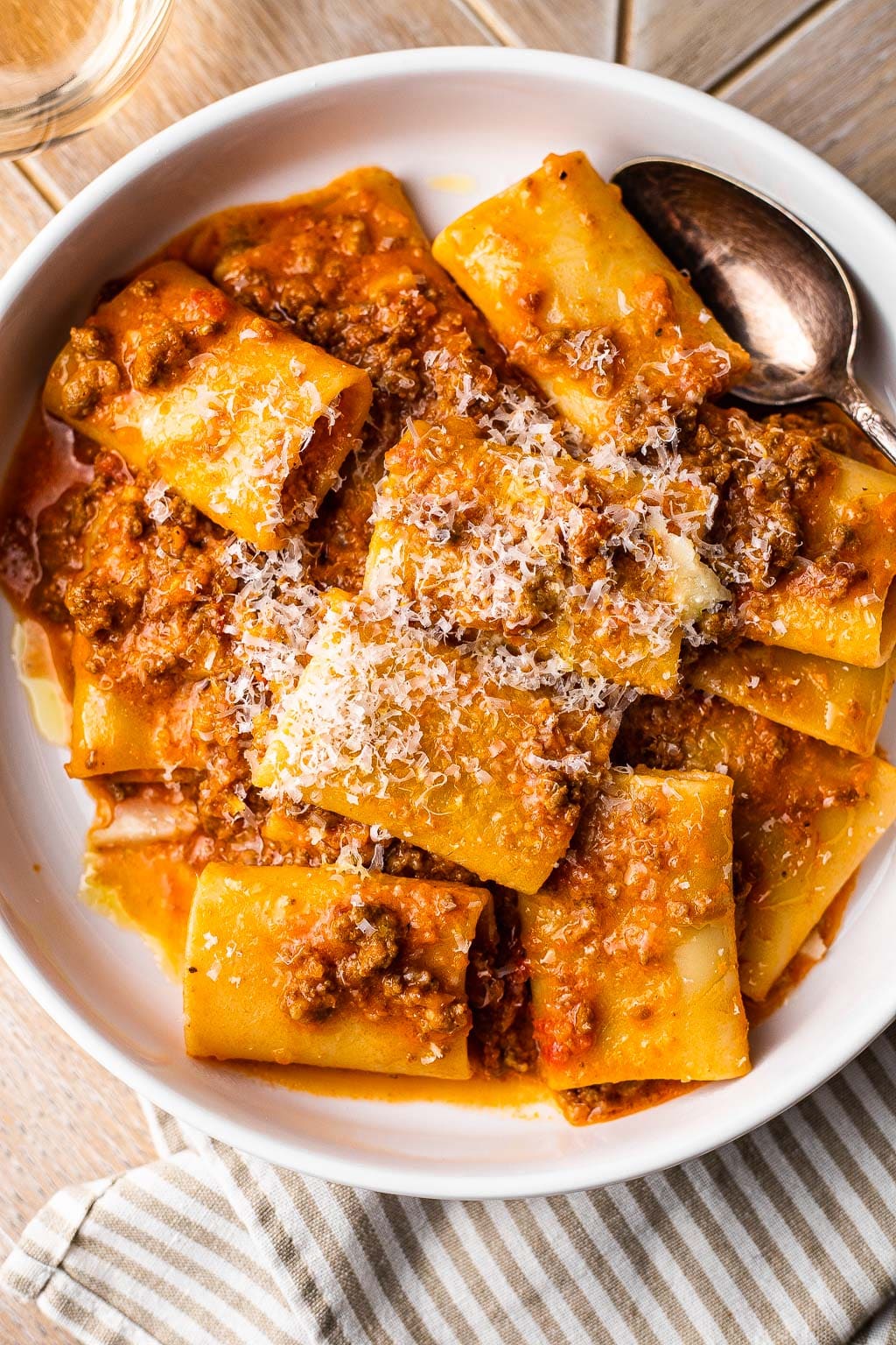 Pasta bolognese topped with grated Parm