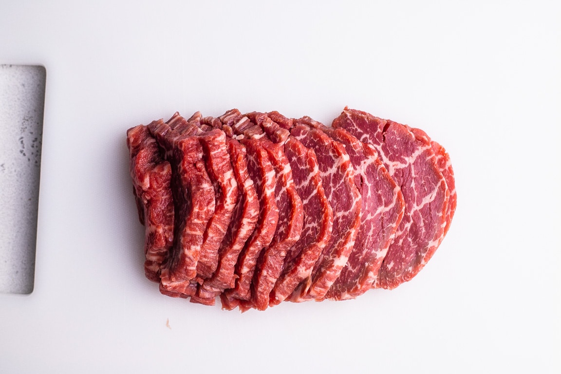 sliced filet mignon on a cutting board