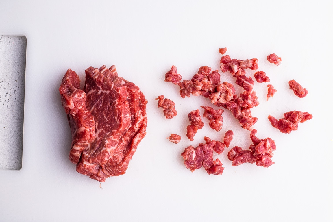 diced filet mignon on a cutting board