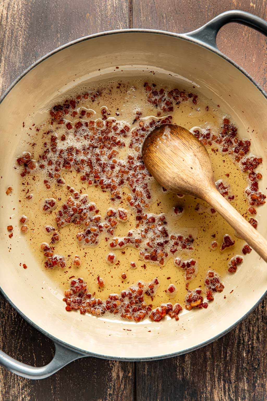 pancetta crisping up in a dutch oven