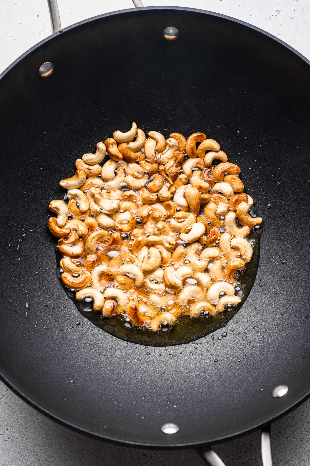 Cashews browning in a wok