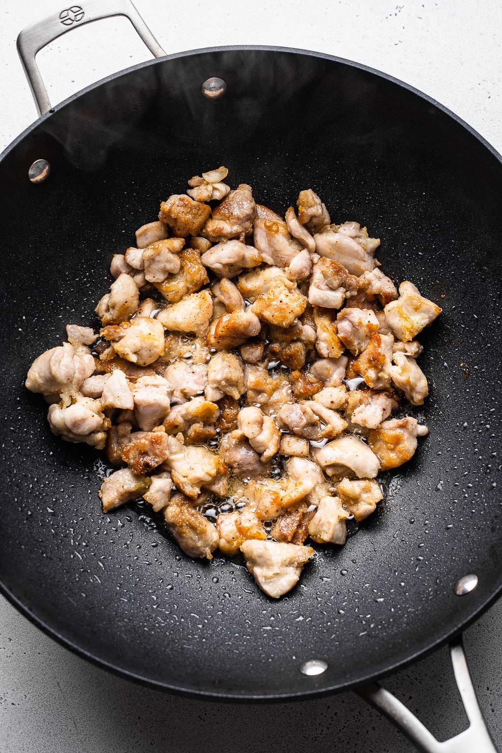 Chicken cooking in a wok