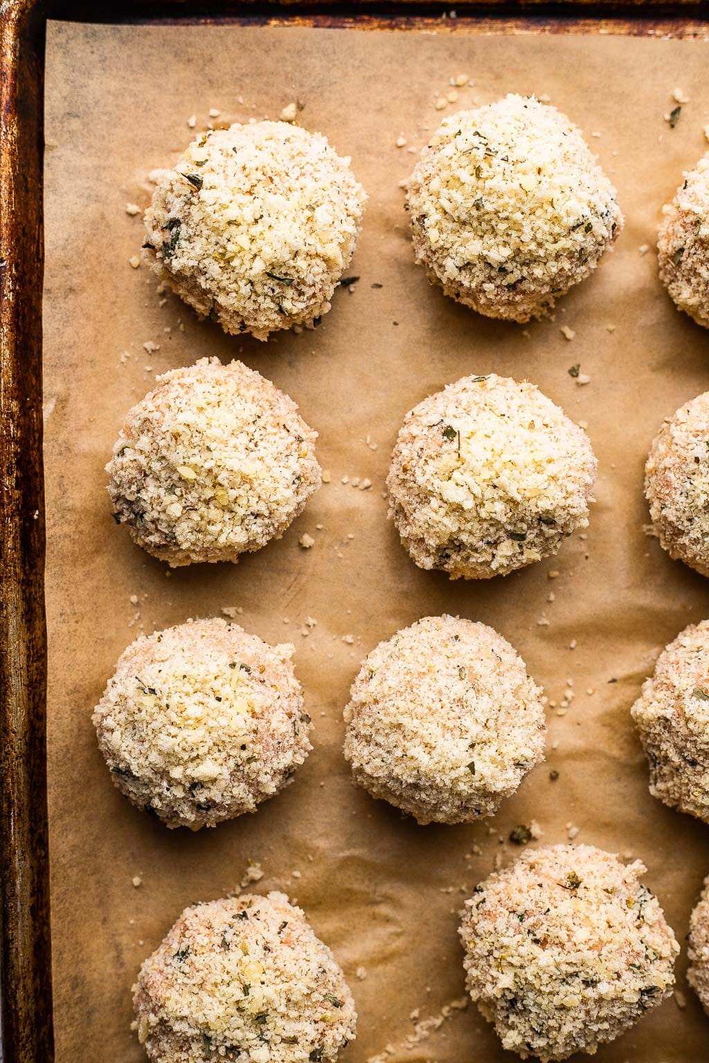 Raw meatballs coated in panko