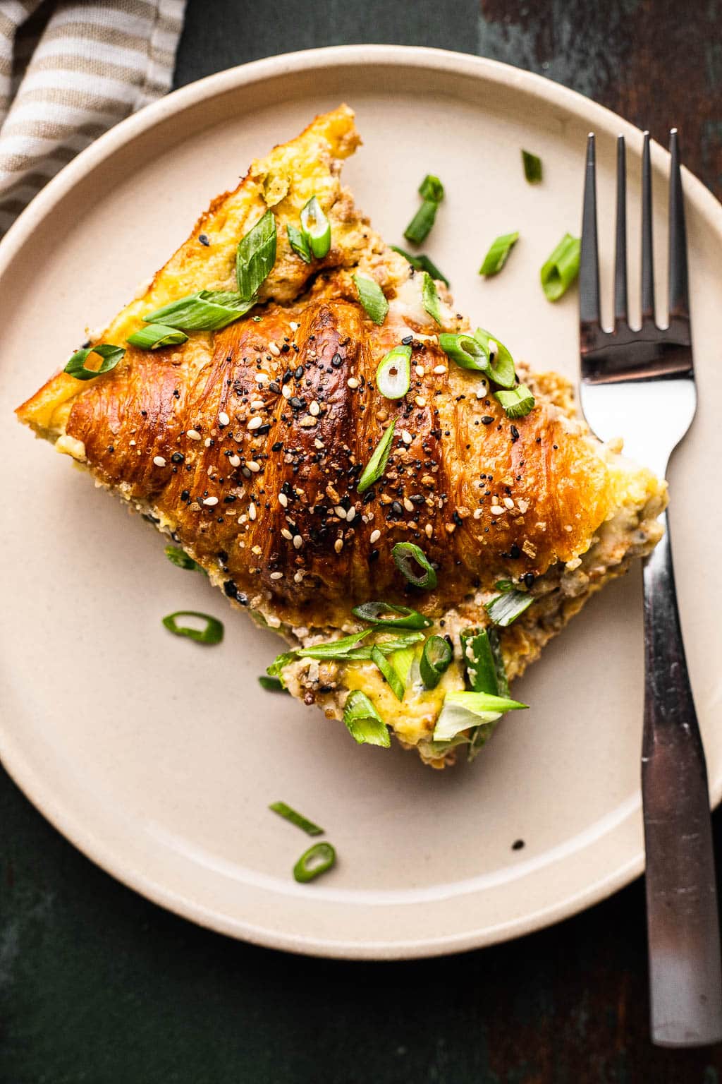 A serving of sausage croissant breakfast casserole 