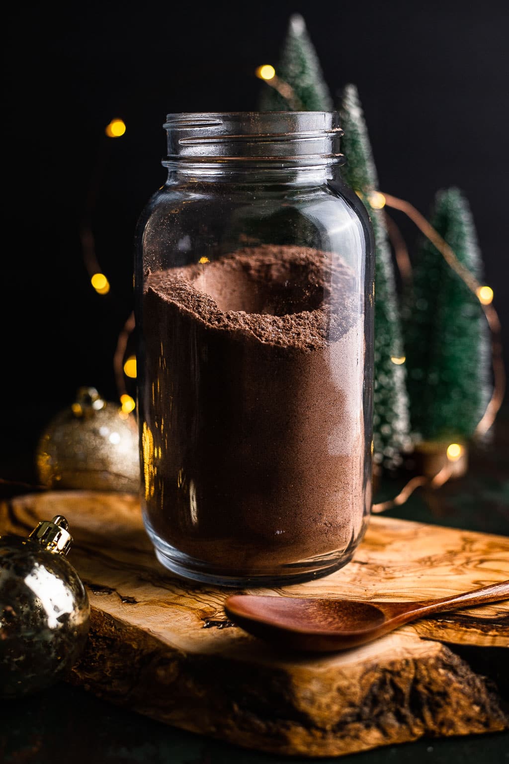 A large jar full of homemade hot chocolate mix. 