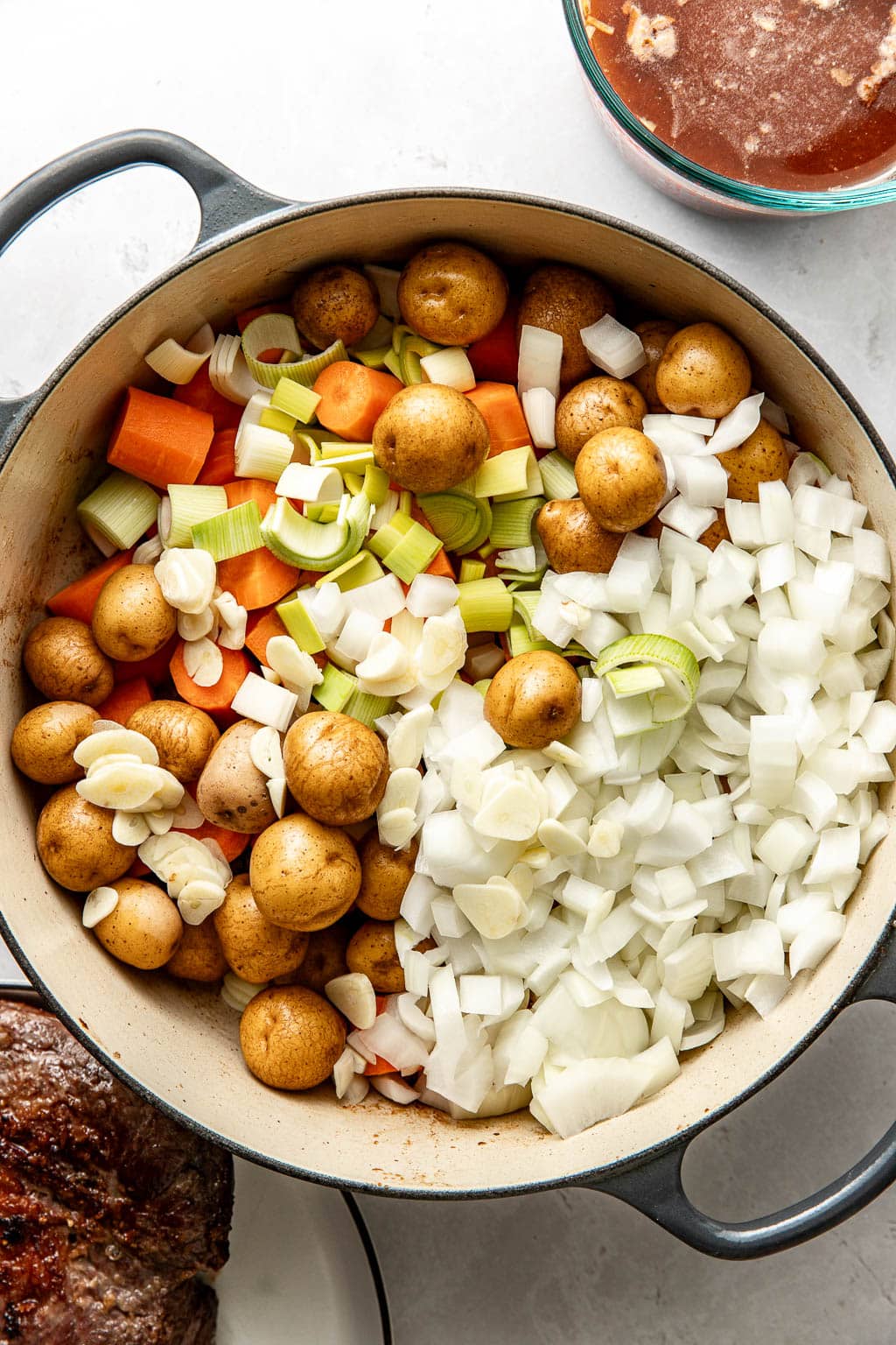 pot roast vegetables in a dutch oven