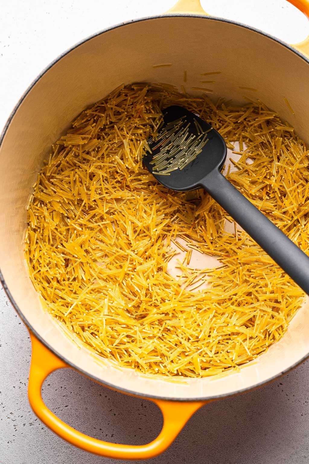 fideo being toasted for sopa de fideo