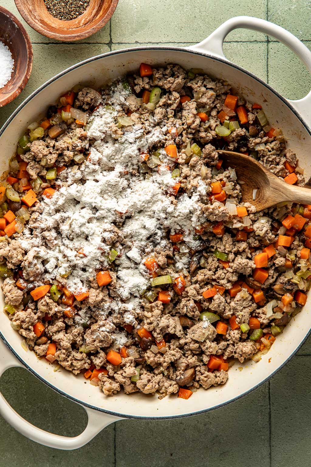 Flour sprinkled on top of the ground turkey mixture