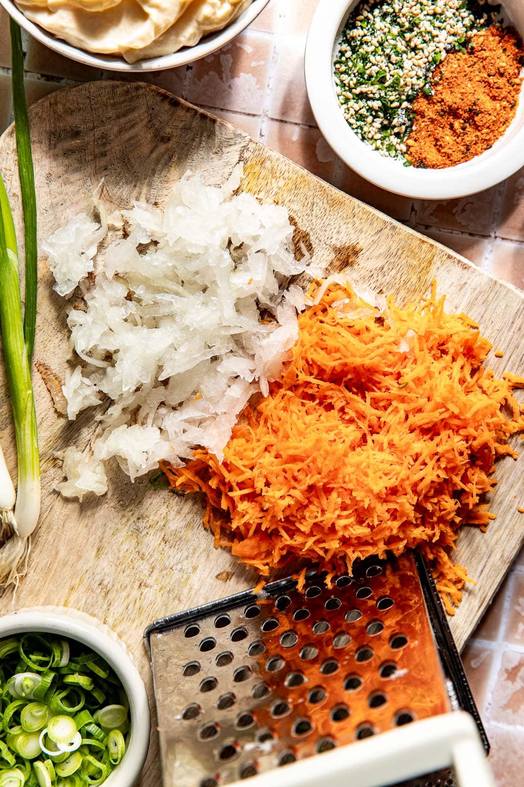 grated carrot and onions for the mac salad dressing