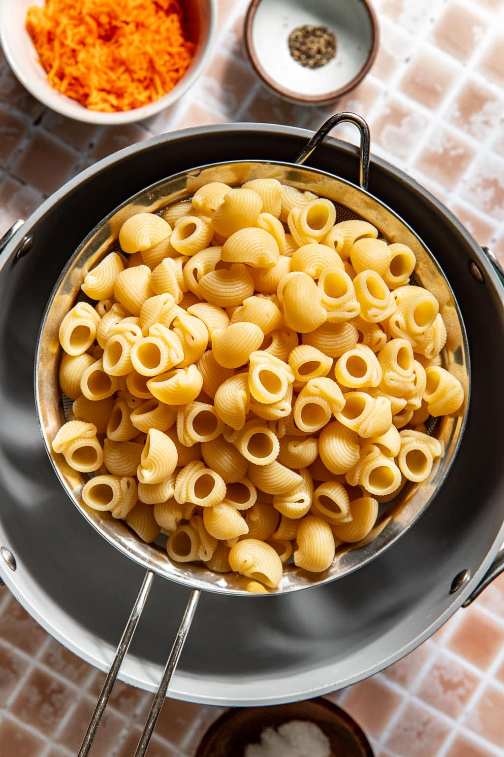 draining cooked pasta in a colander