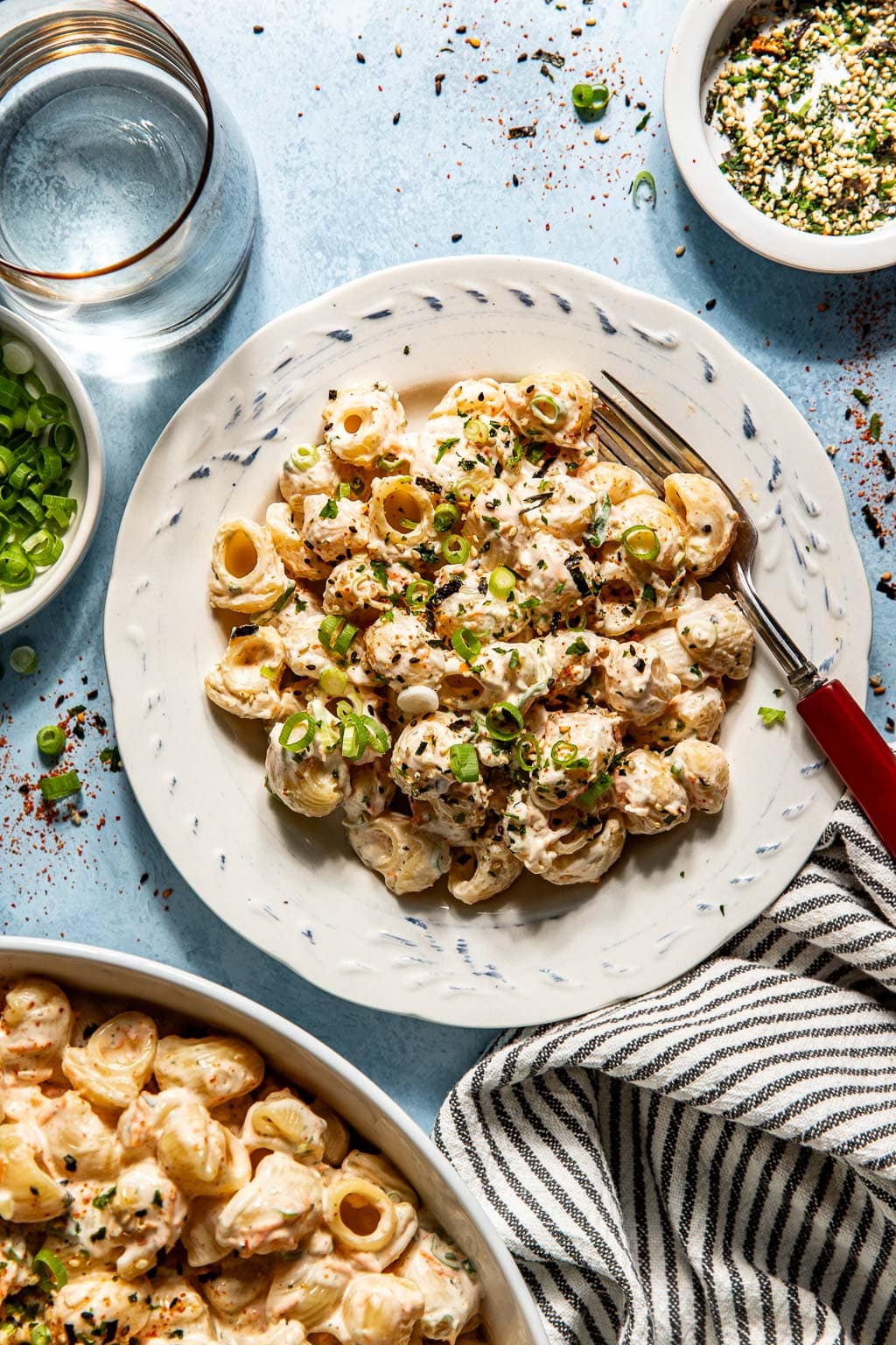 a serving of mac salad on a plate with a fork