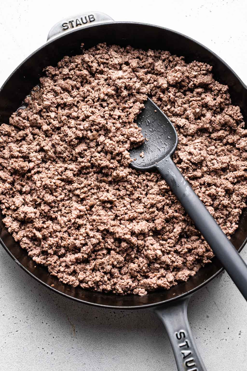 Browned ground beef in a skillet 