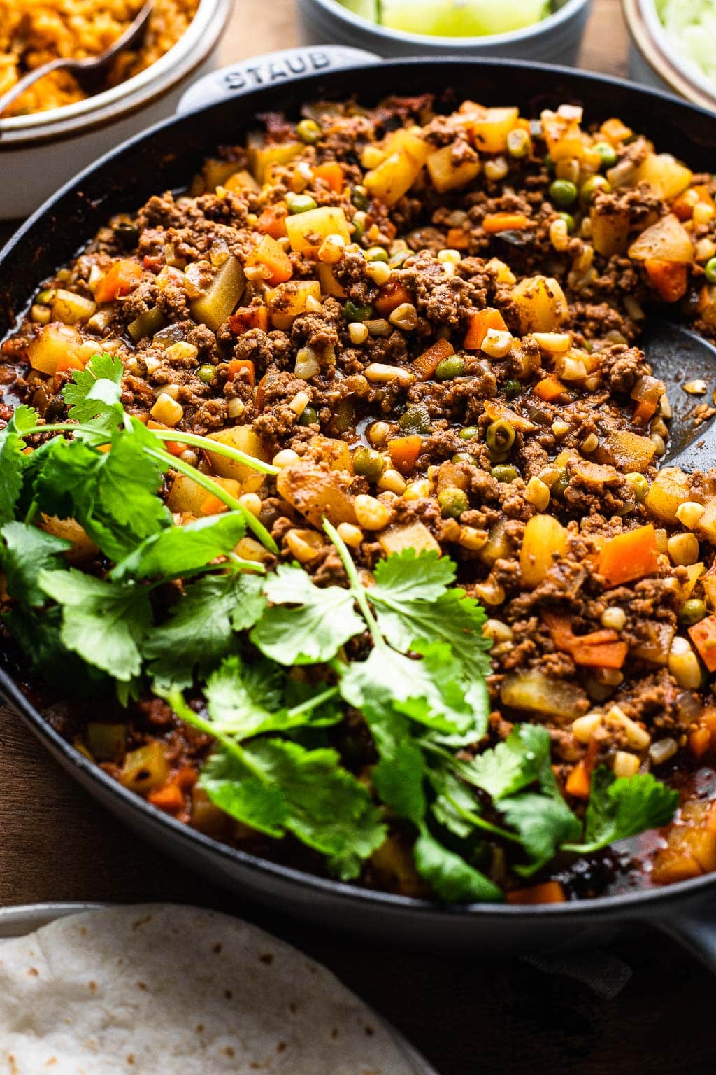 ground beef Mexican Picadillo in a skillet 