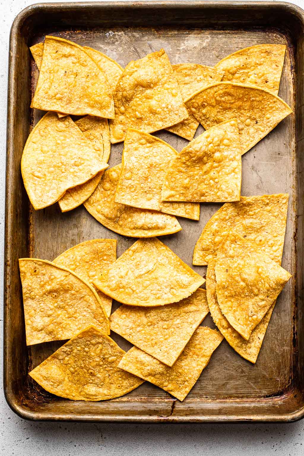 Tortilla chips on a baking sheet 