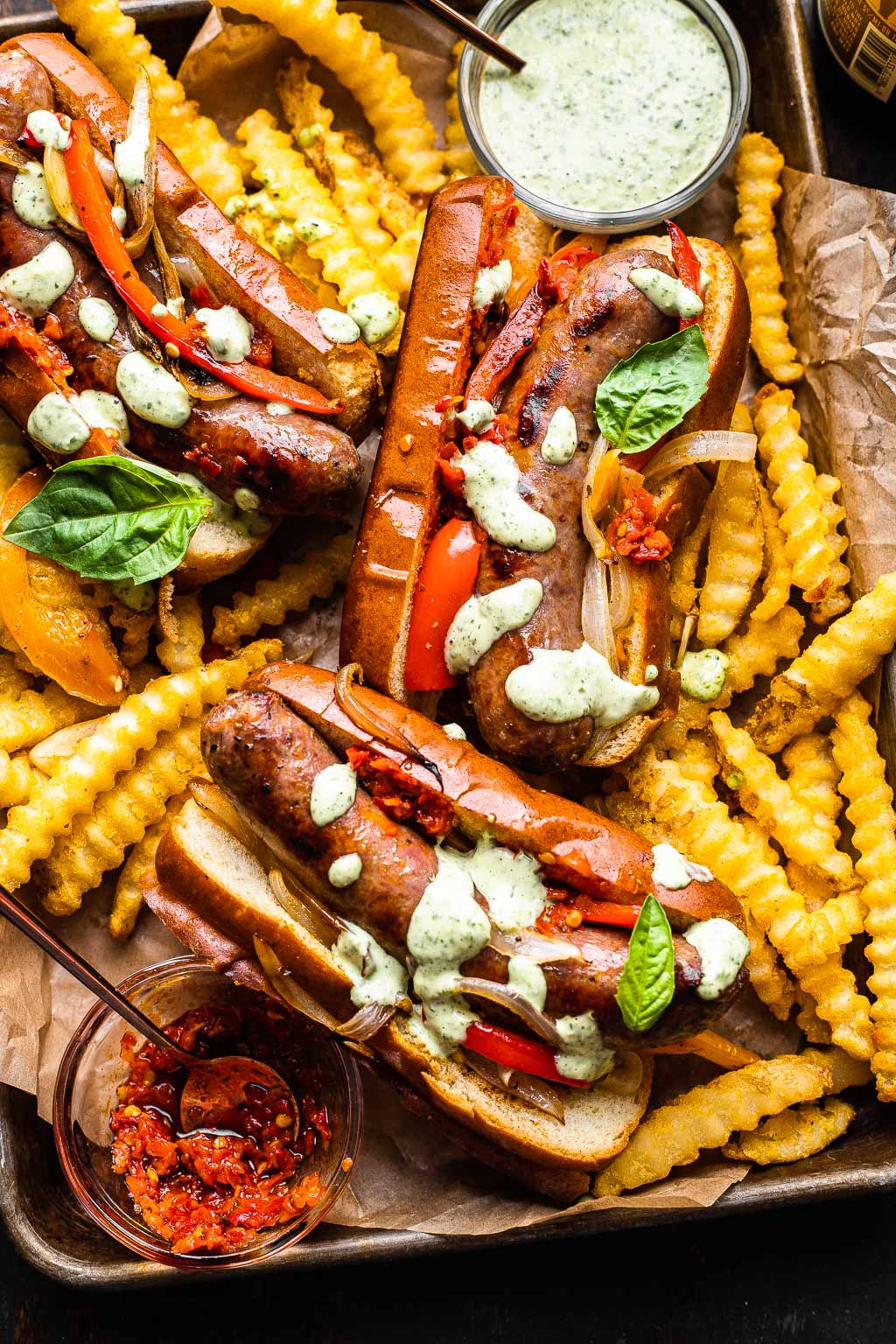 Three Italian sausage sandwiches with fries 