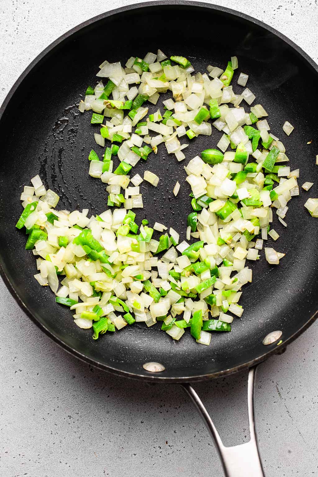 Onion and jalapeño in a skillet 