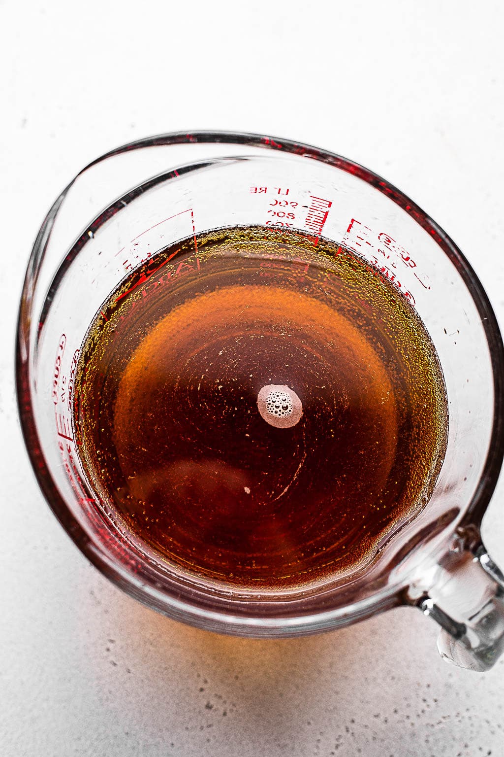 Chicken wing brine in a measuring cup