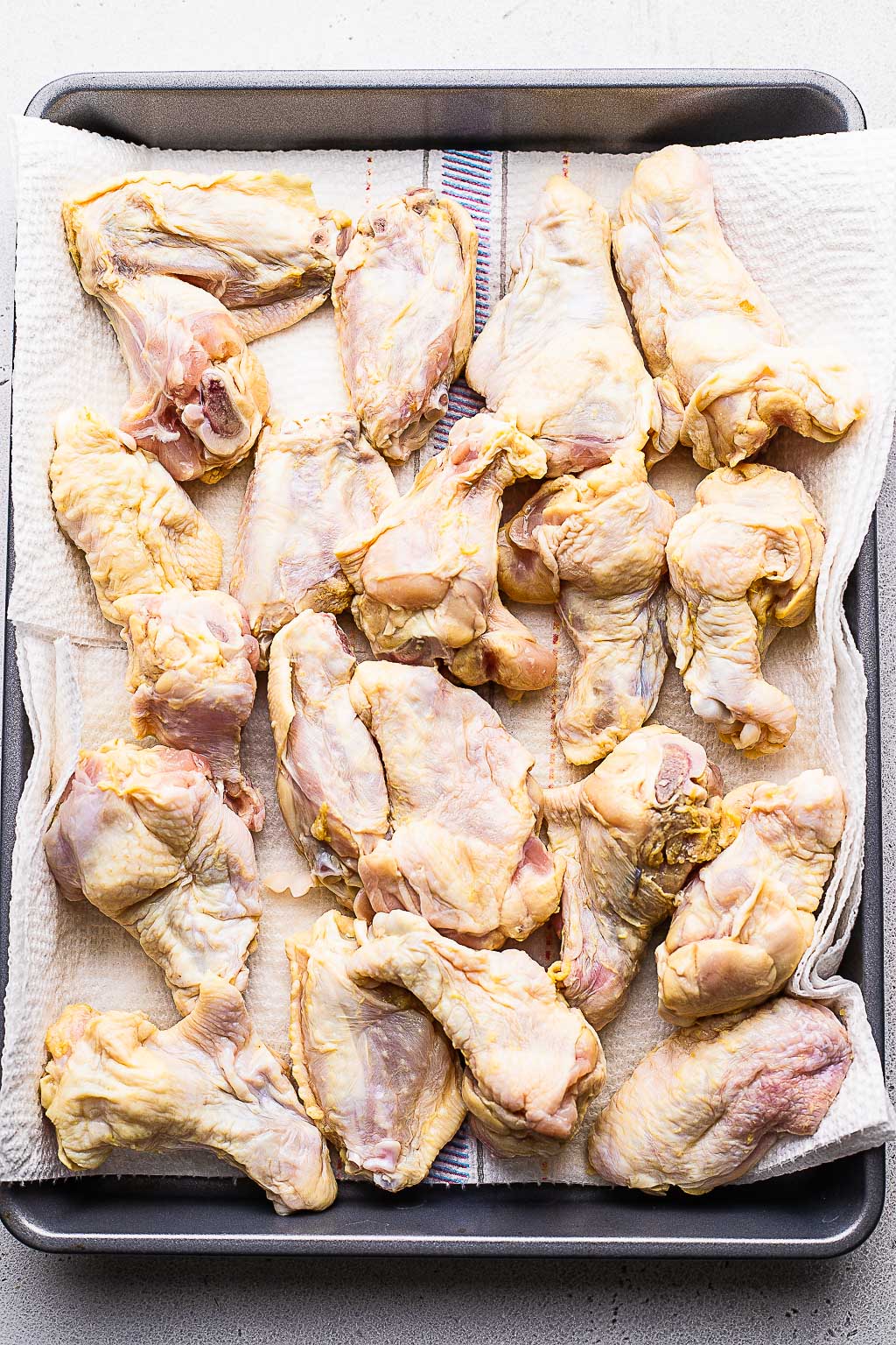 Chicken wings on baking tray 