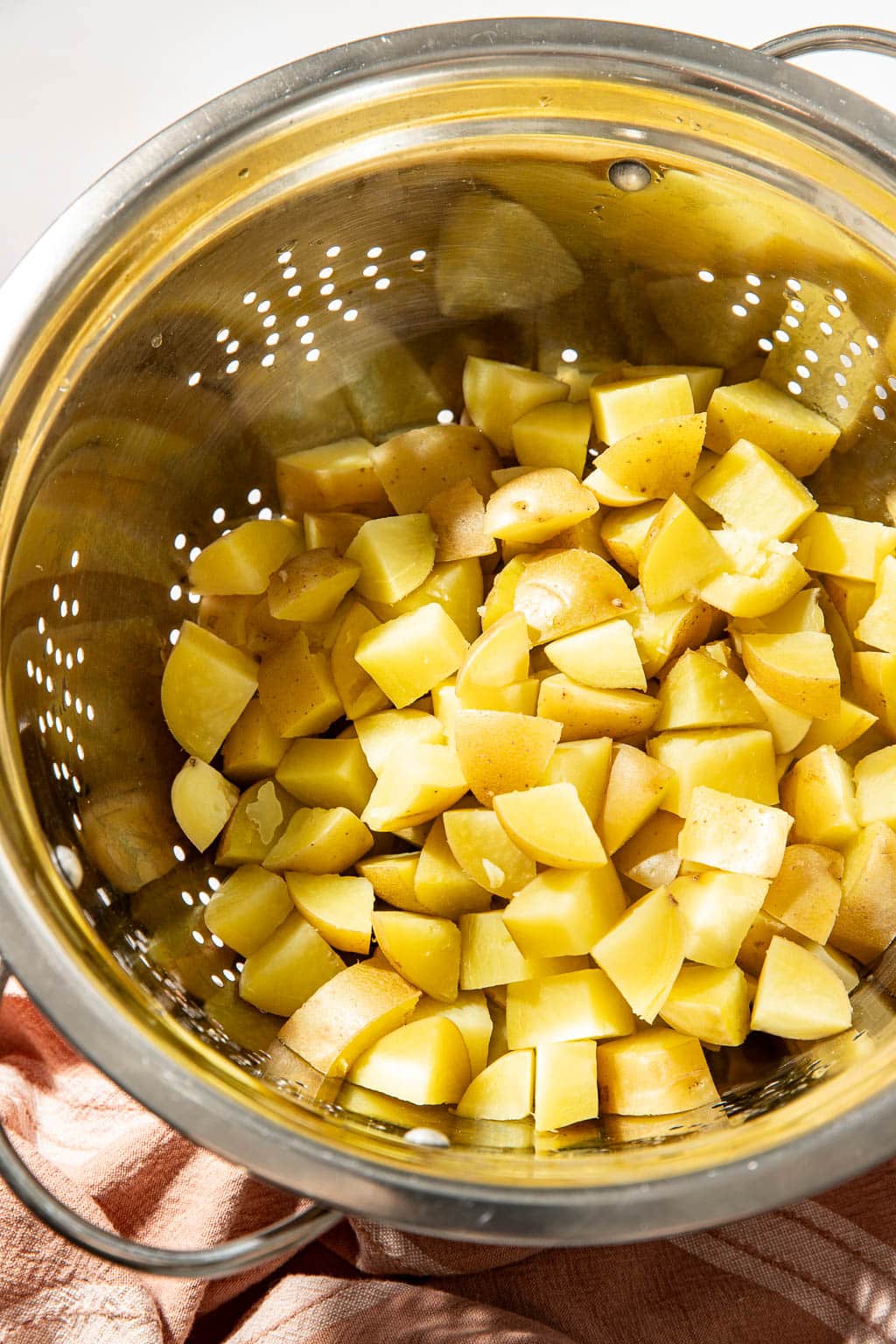 potatoes in a colander after boiling