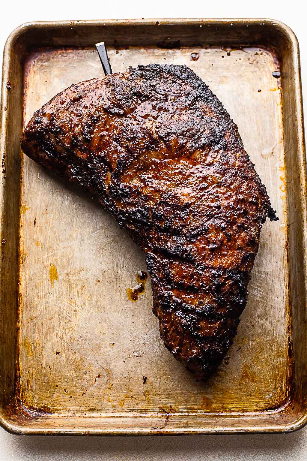 A grilled tri-tip, seasoned with coffee rub