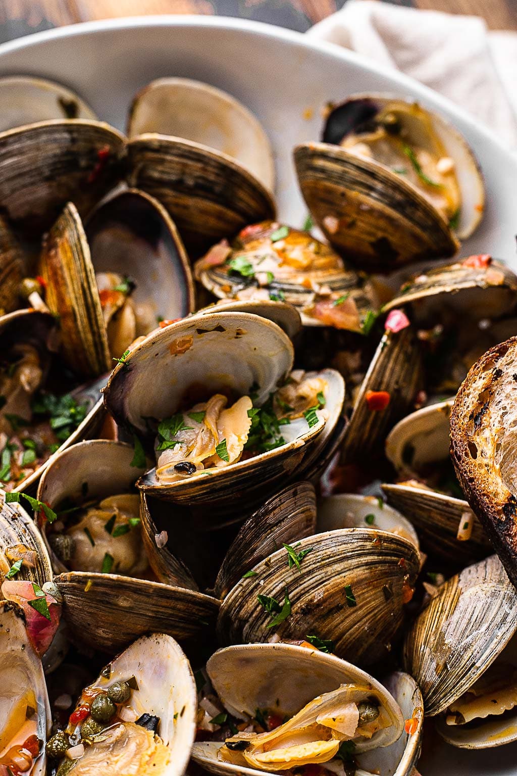 Spicy grilled clams in a bowl 