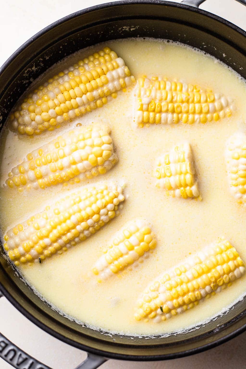 Fresh ears of corn in a butter bath 