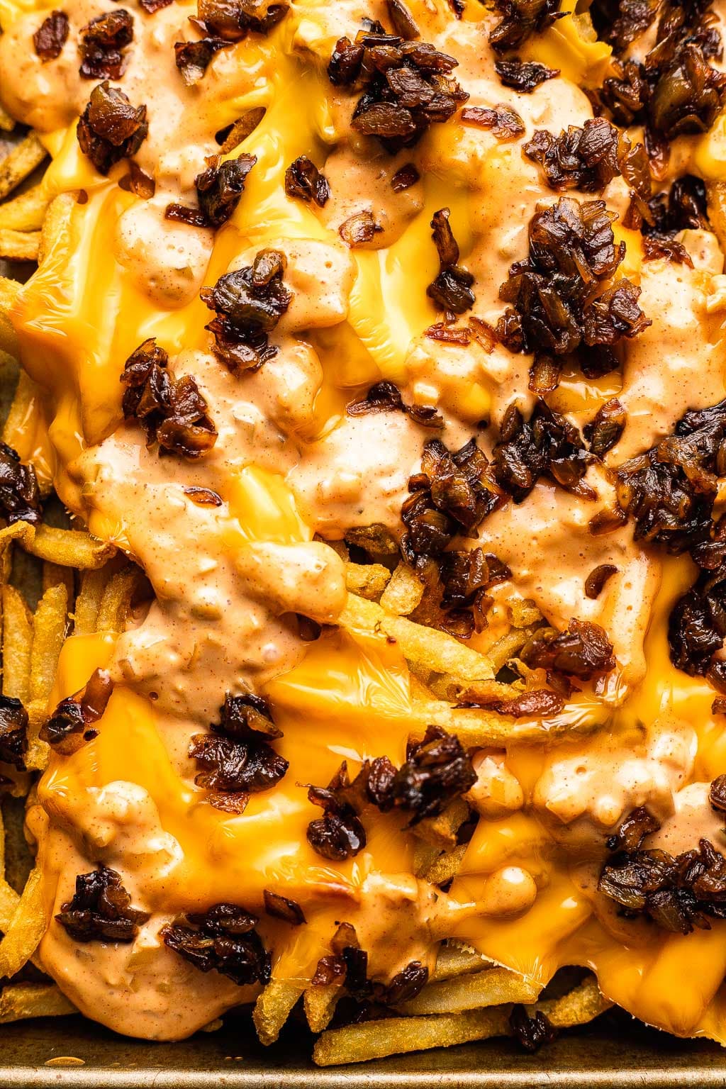 Copycat animal fries topped with special sauce, cheese, and caramelized onions. 