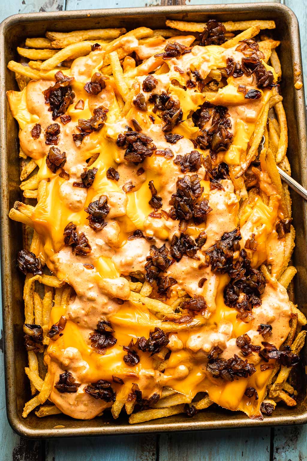 homemade animal style fries on a sheet pan