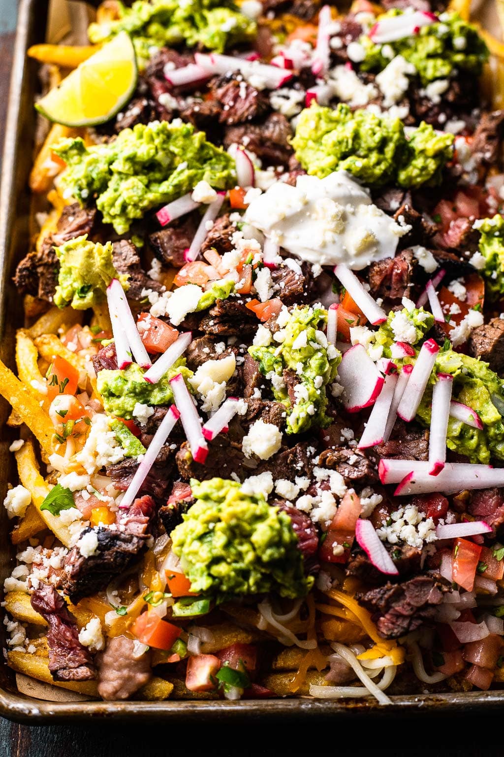 Carne Asada Fries on a sheet pan