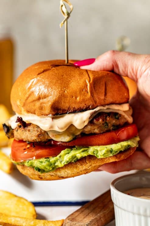 Spicy southwest turkey burgers in hand