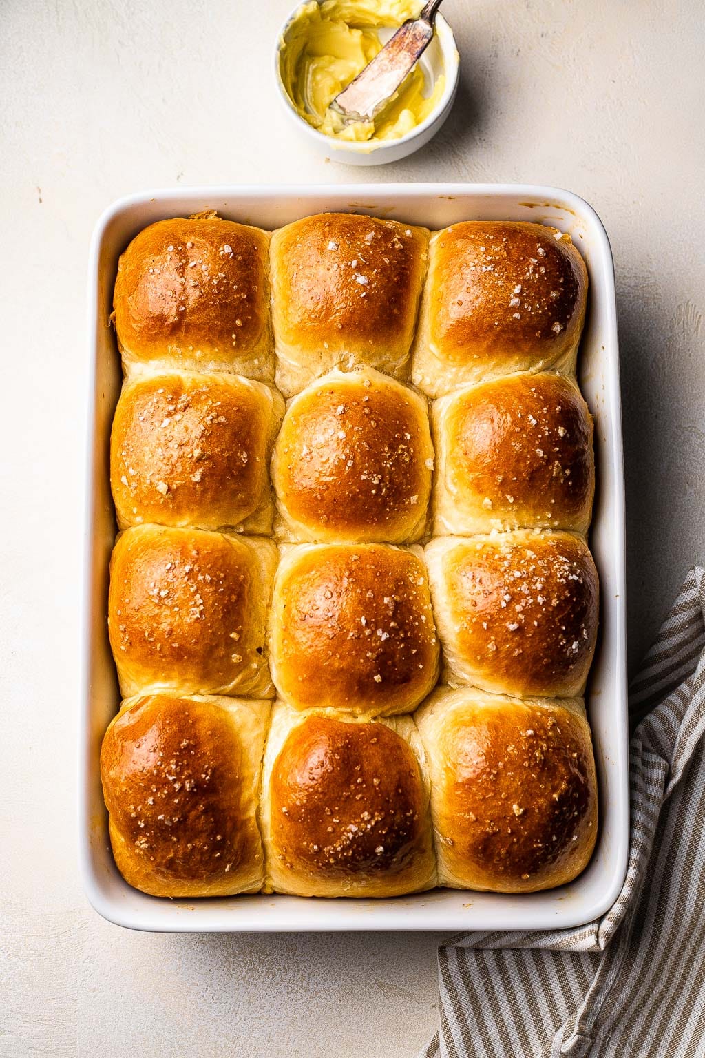 A pan of brioche dinner rolls