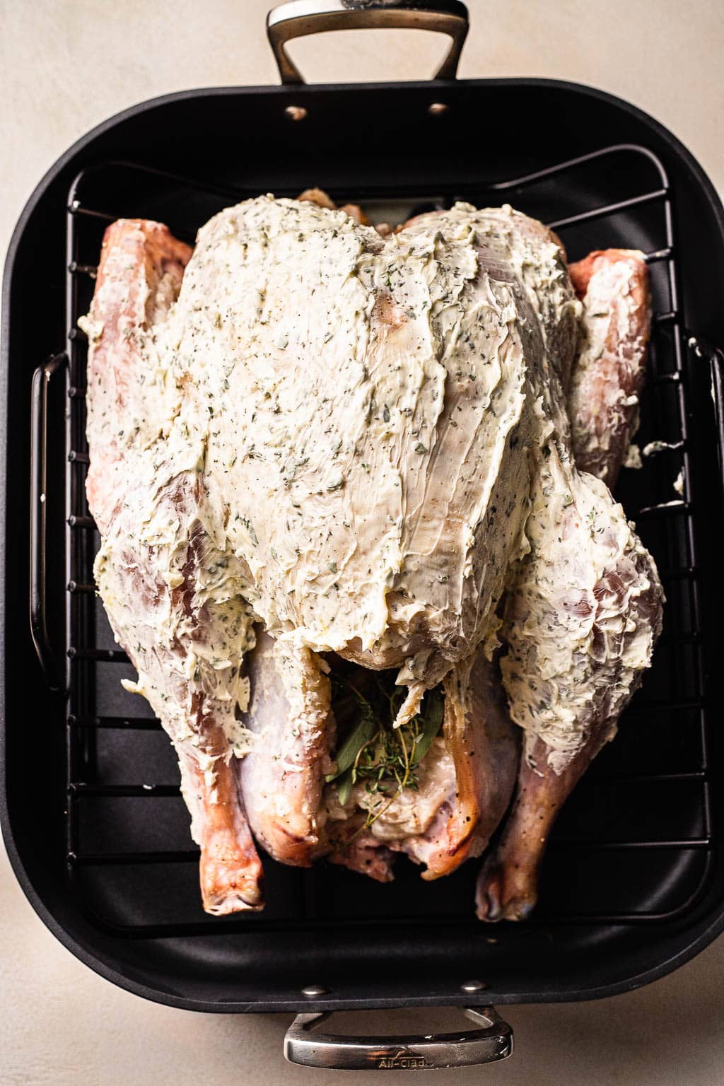 A turkey rubbed with garlic herb butter 