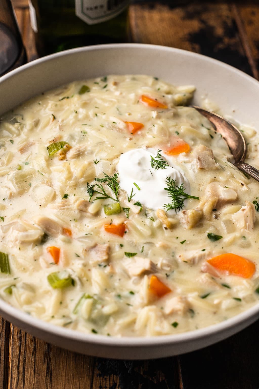 A bowl of creamy chicken soup with orzo