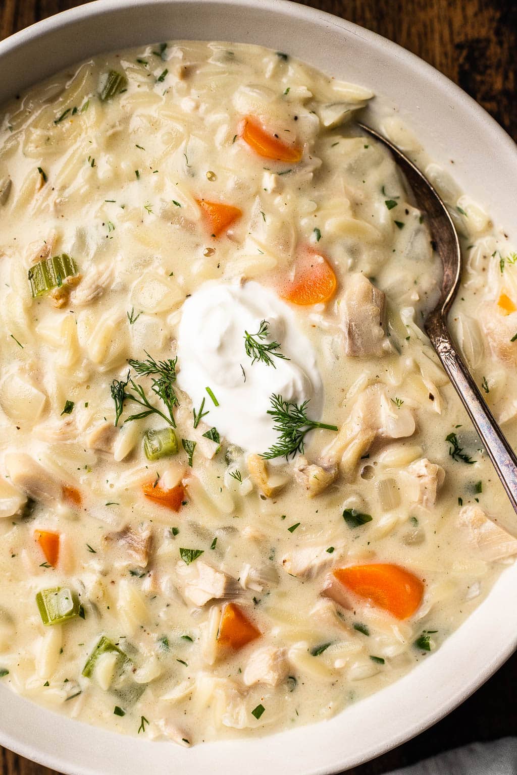 A bowl of creamy orzo chicken soup